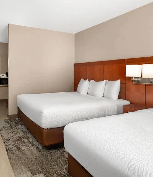 Hotel guest room with two commercial mattresses