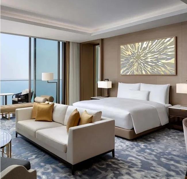 Hotel guestroom furnished to brand spec